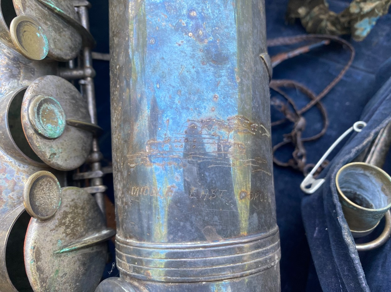 Ship etched into sax